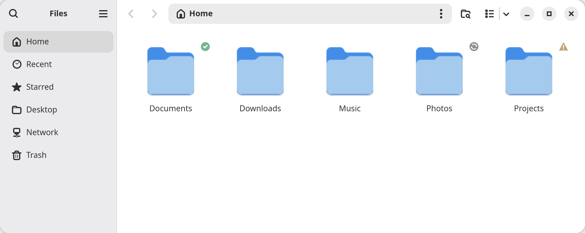 Files showing the home folder: Documents up to date, Photos syncing, Projects with a conflict